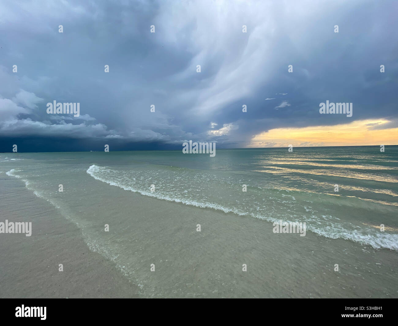 Storm clouds over Gulf of Mexico at sunset Stock Photo