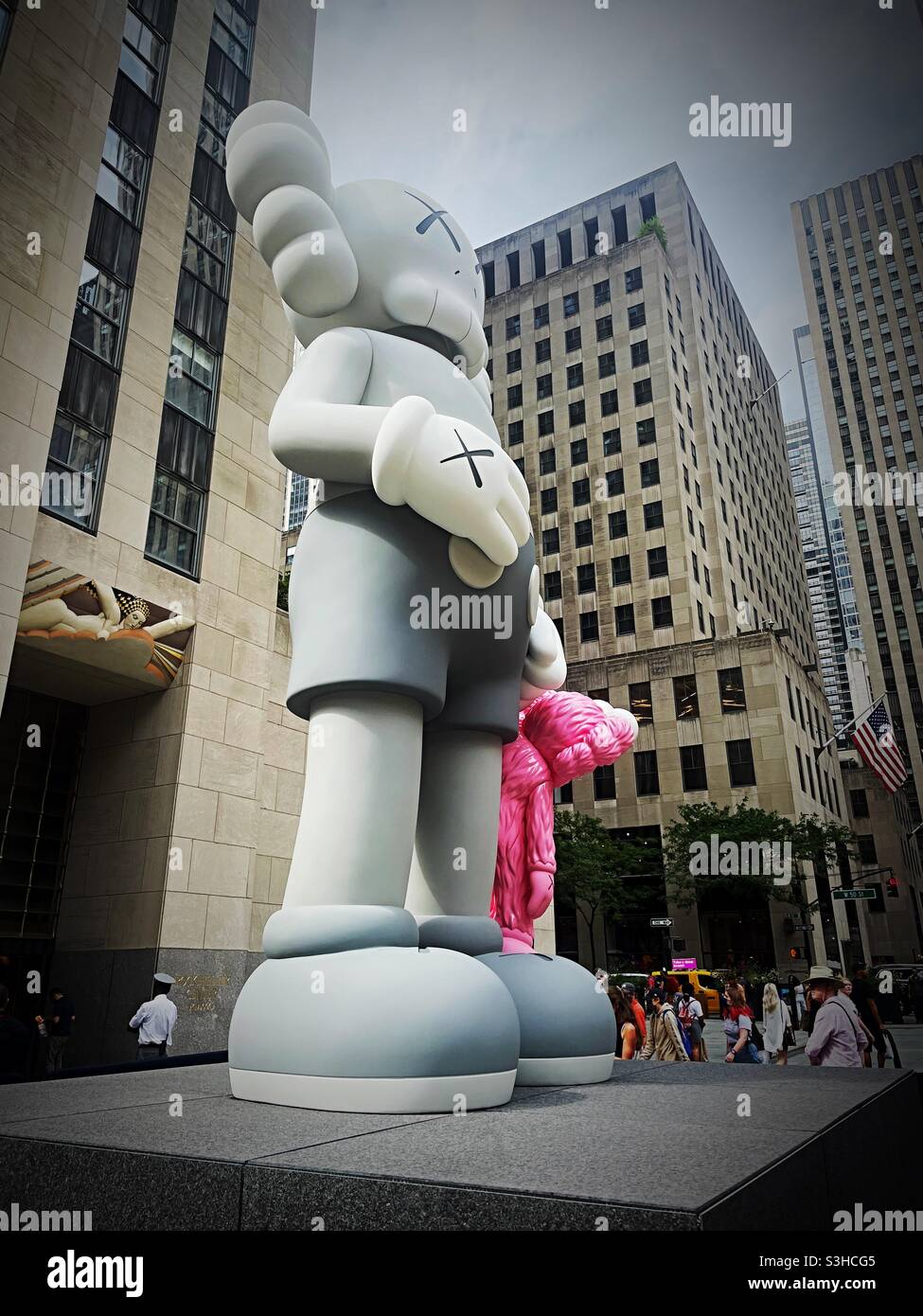 Kaws statue display in front of 30 rock, NYC, 2021, USA Stock Photo