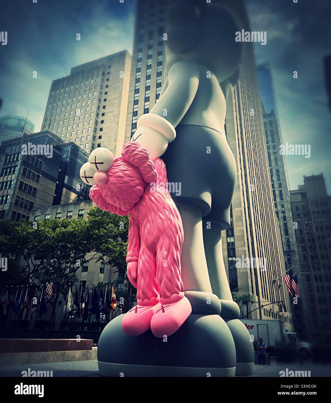 Kaws New commission share combined companion and BFF in a display in front of 30 rock, NYC, USA, 2021 one - Smartphone Captured Stock Image