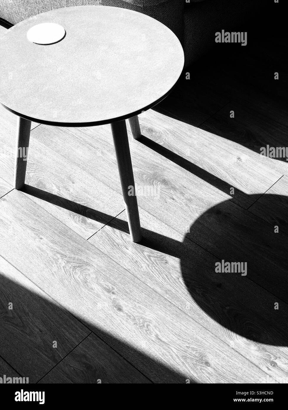 Abstract with table and shadow in black and white - Smartphone Captured Stock Image