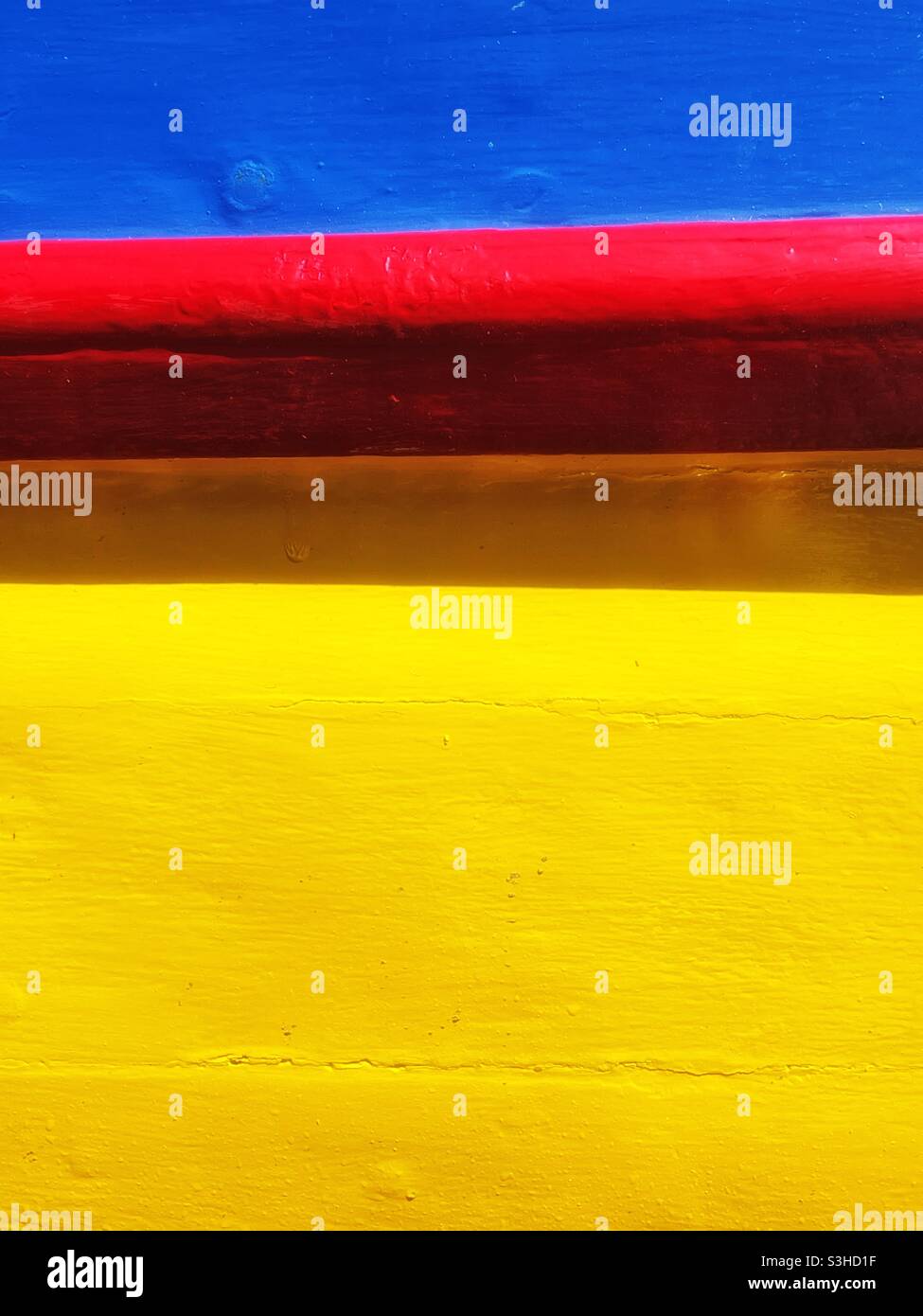 Detail of a colourful fishing boat moored in a Cornish harbour, August. - Smartphone Captured Stock Image