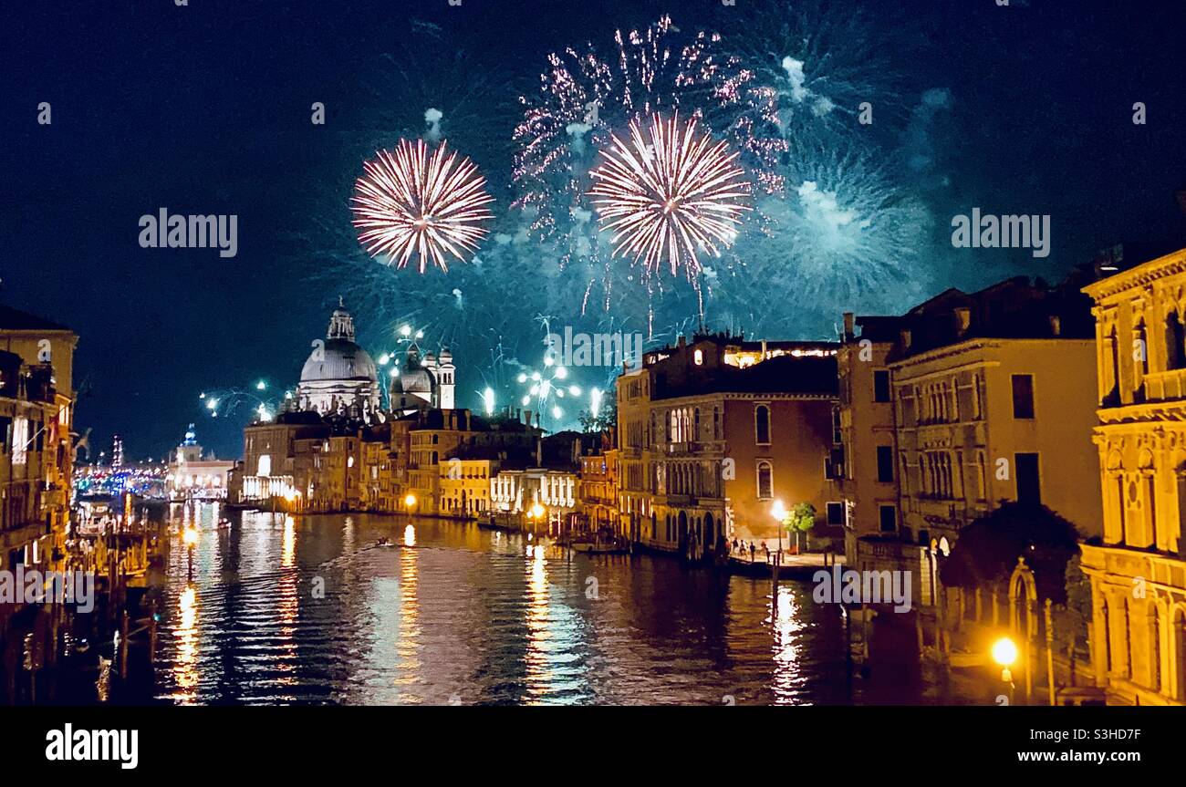 Fireworks in the 2021 Venice Redentore Festival (Feast of the Redeemer), a popular 400 year old festival that celebrated the end of the plague in the 16th century. Venice, Italy - Smartphone Captured Stock Image