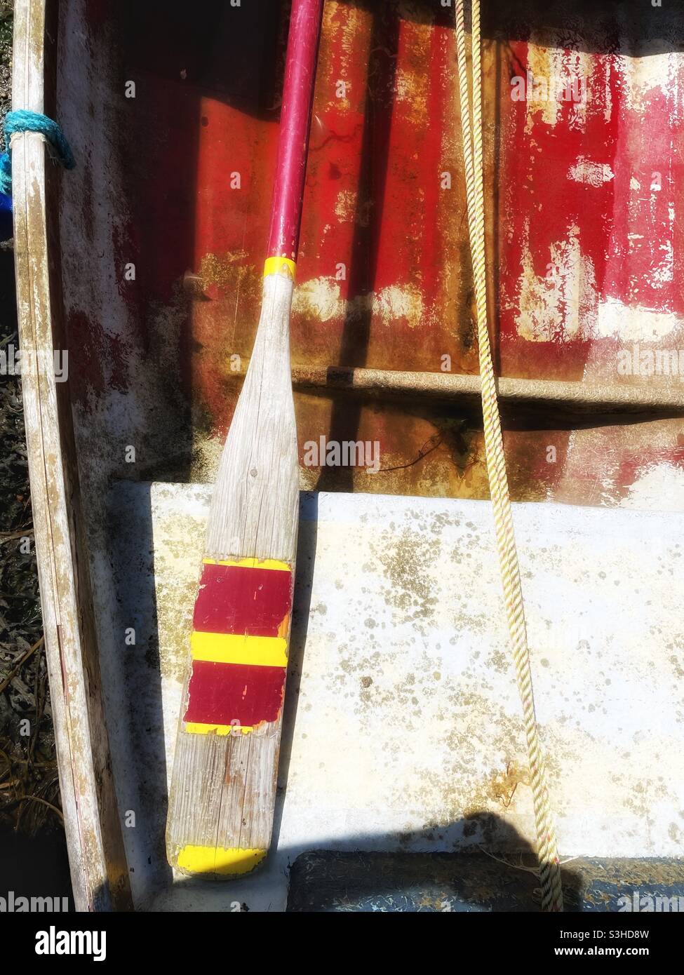 Detail of small rowing boat moored in a Cornish harbour, August. - Smartphone Captured Stock Image