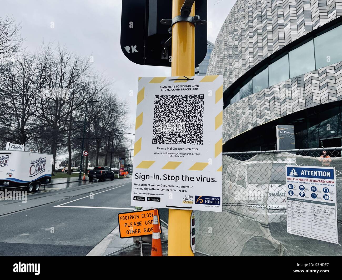 A Covid-19 covid tracer app QR code poster in central Christchurch New Zealand - Smartphone Captured Stock Image
