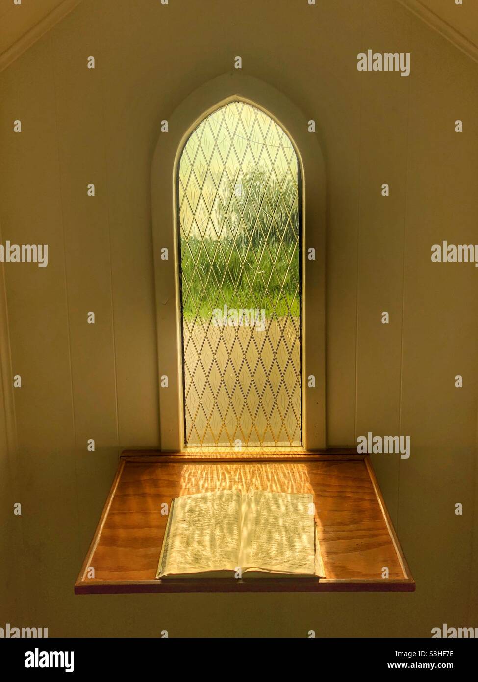 Light shines into a small chapel. - Smartphone Captured Stock Image