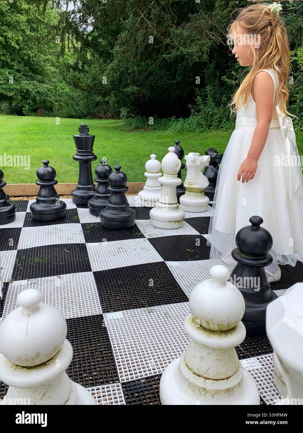 Young white child playing a game of chess on large chess board. Chess board  on table in front of school boy thinking of next move by Len44ik Vectors &  Illustrations with Unlimited