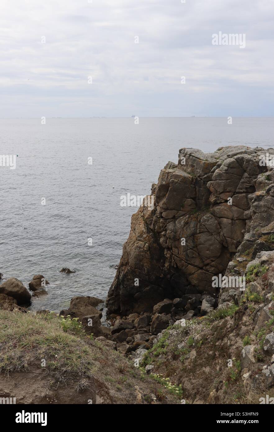 the rocks and cliffs at the wild coast from Le Croisic to Batz Sur Mer in a french department, Loire Atlantique - Smartphone Captured Stock Image