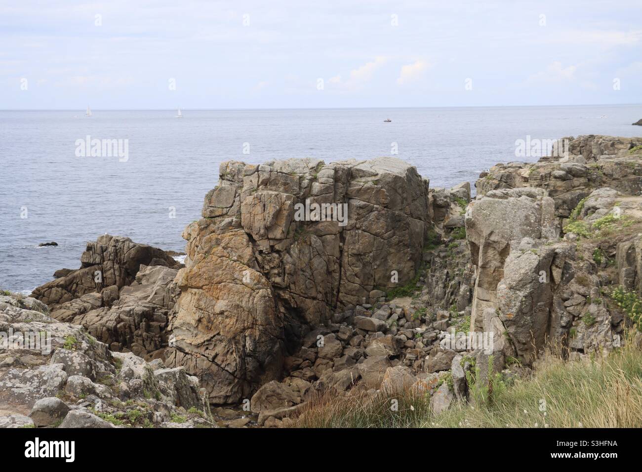 the rocks and cliffs at the wild coast from Le Croisic to Batz Sur Mer in a french department, Loire Atlantique - Smartphone Captured Stock Image