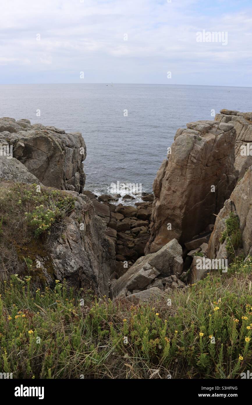 the rocks and cliffs at the wild coast from Le Croisic to Batz Sur Mer in a french department, Loire Atlantique - Smartphone Captured Stock Image