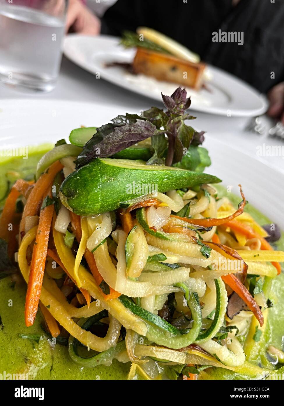 Close-up of a gourmet dish of spaguettini squash served at an upscale restaurant in New York City, USA - Smartphone Captured Stock Image
