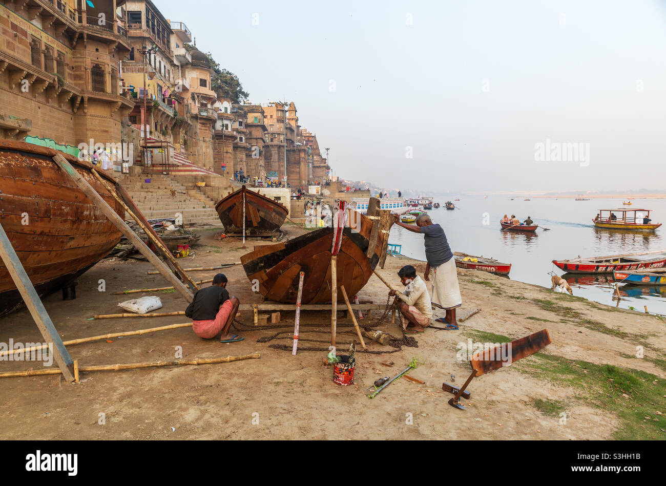 Shipwrites making a new boat on the bank of river Ganges in Varanasi, India - Smartphone Captured Stock Image