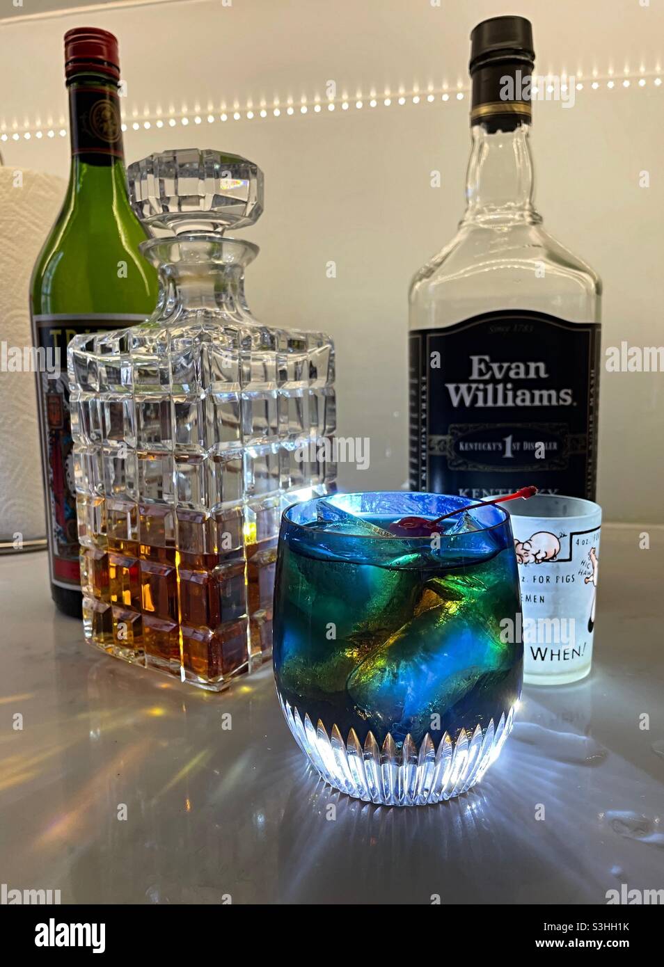 The ingredients for a classic Manhattan along with crystal decanter and Waterford crystal Tumbler, NYC, USA - Smartphone Captured Stock Image