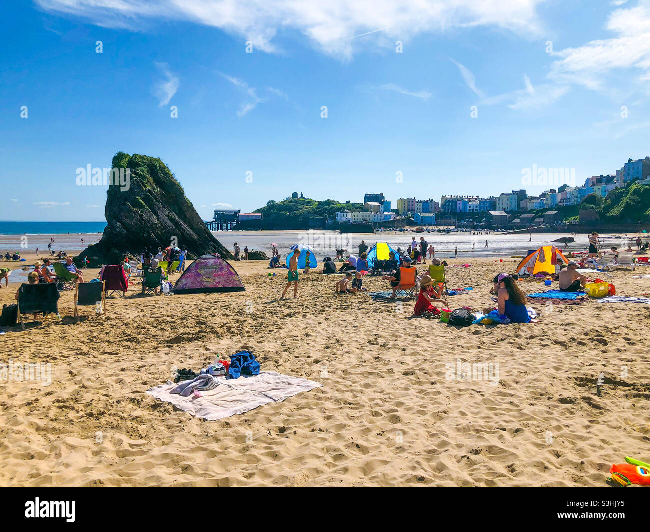 People on the beach a Tenby in Pembrokeshire, Wales, UK on a hot and sunny summer’s day. - Smartphone Captured Stock Image