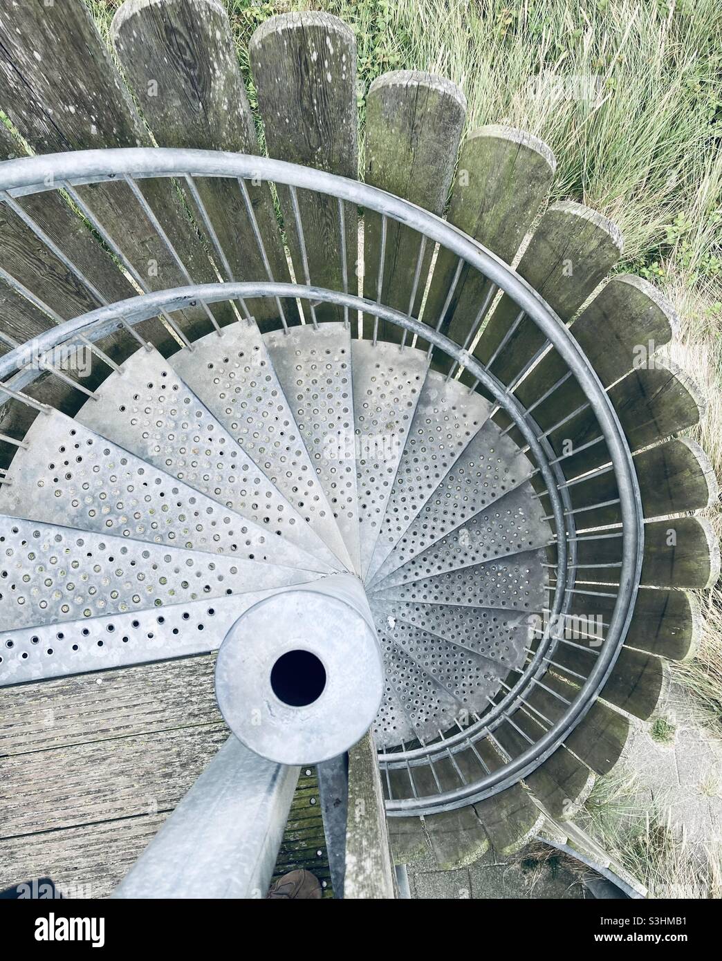 top view of a metal spiral staircase Stock Photo