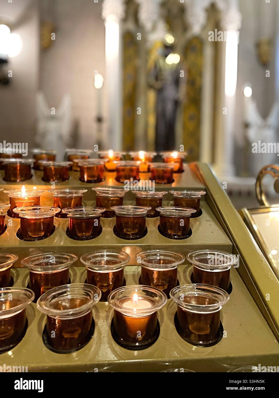 Close up of votive prayer candles in St. Patrick’s Cathedral NYC, USA - Smartphone Captured Stock Image