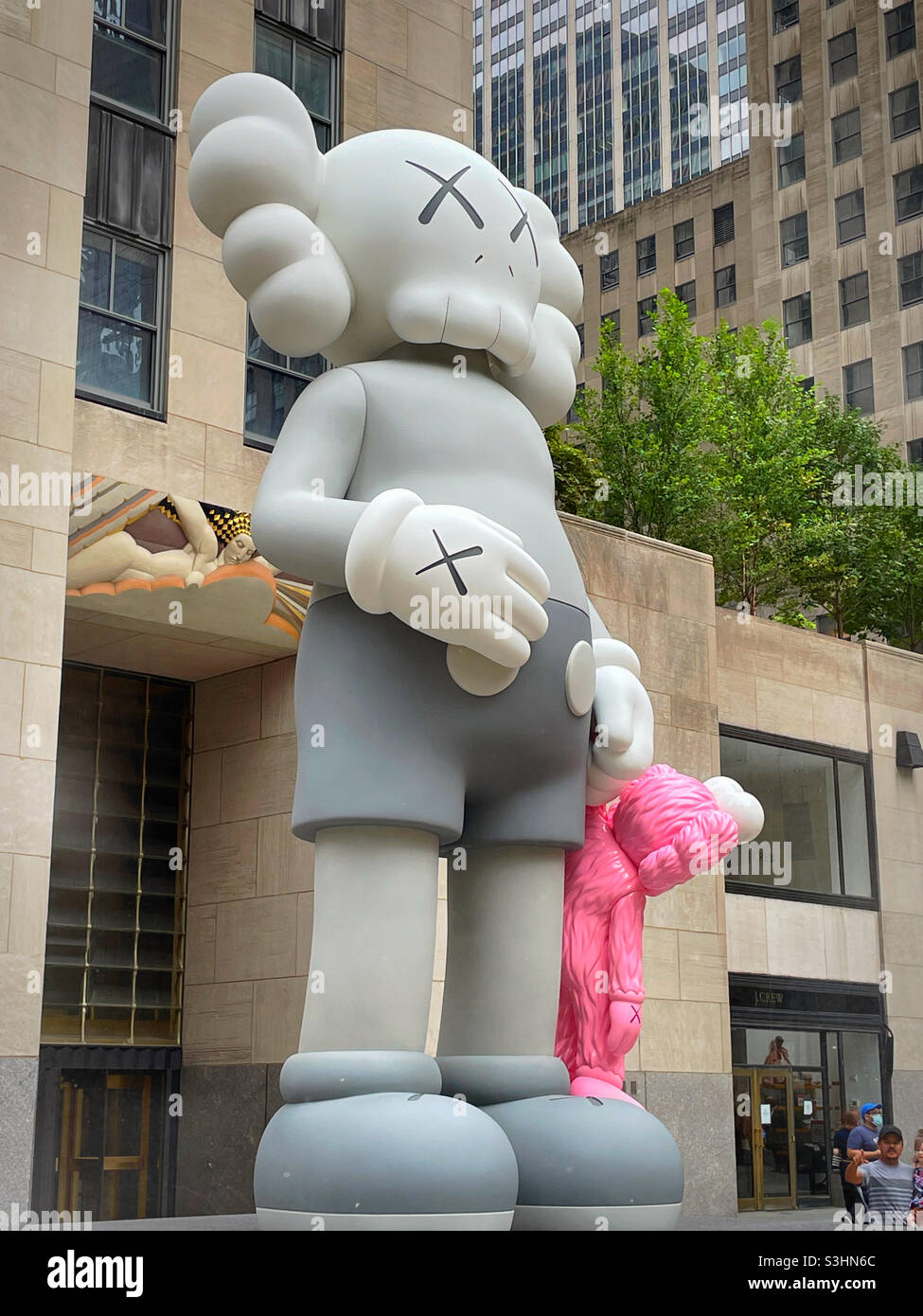 Giant Statue,Share , by the artist Kaws At Rock center, NYC,USA, 2021 Stock  Photo - Alamy