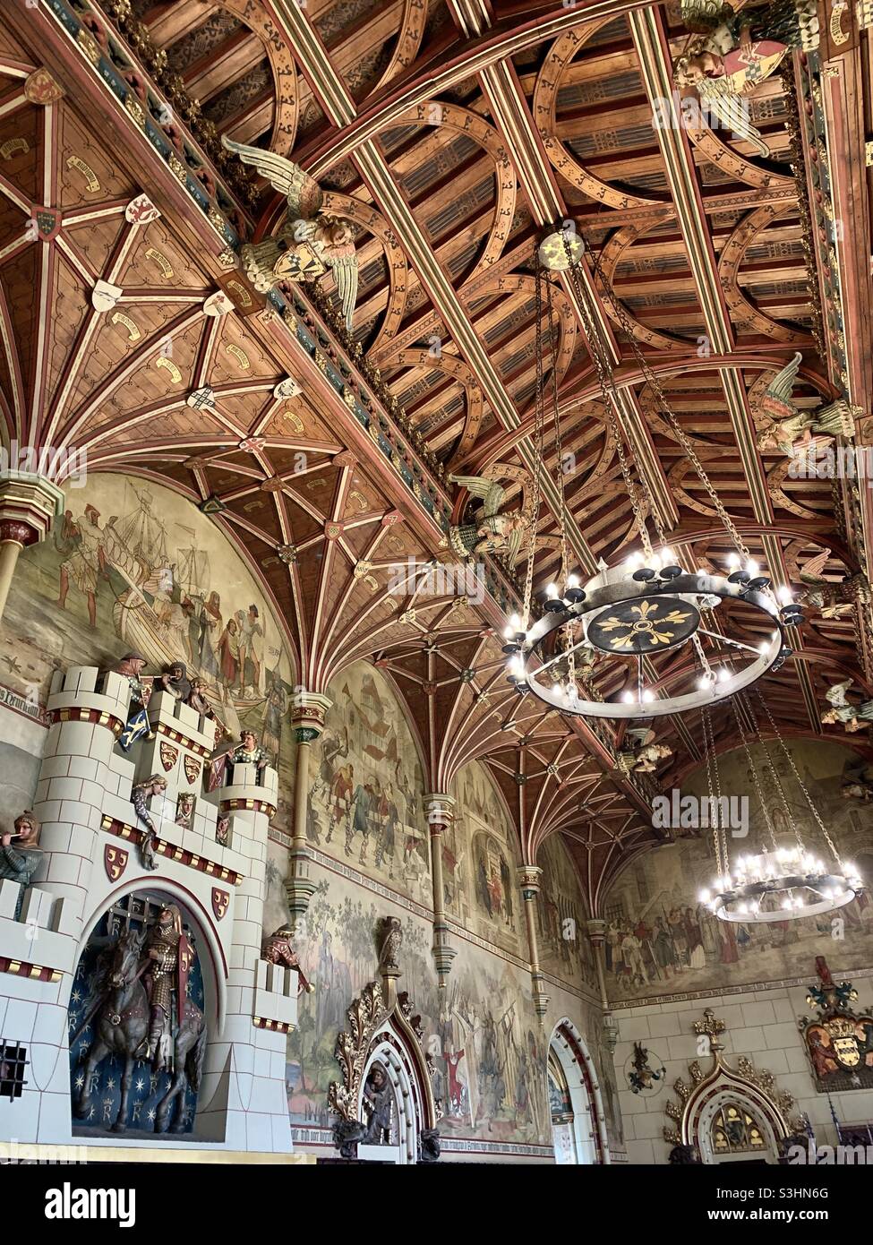 Wooden ceiling with chandeliers at Cardiff castle Stock Photo