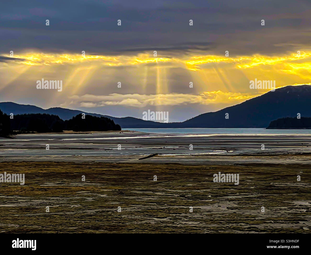 Rays of light beaming on Gastineau Channel Stock Photo