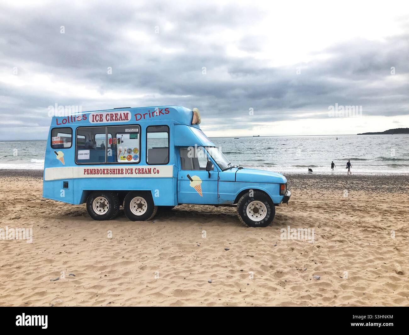 Converted Range Rover ice cream van on the beach at Tenby Pembrokeshire Wales in August 2021 - Smartphone Captured Stock Image
