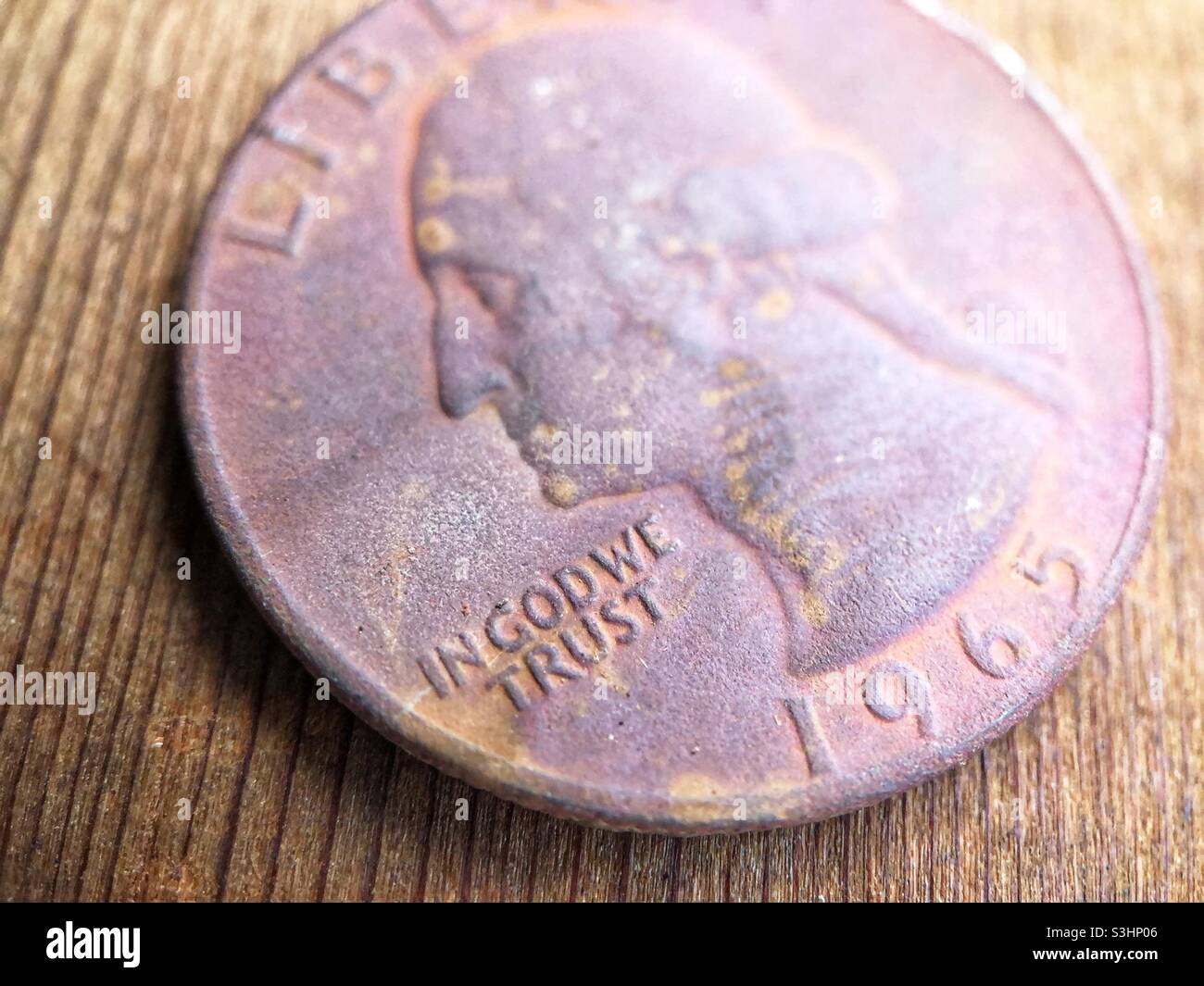 Rusty 1965 Quarter Dollar found buried in a garden Stock Photo Alamy