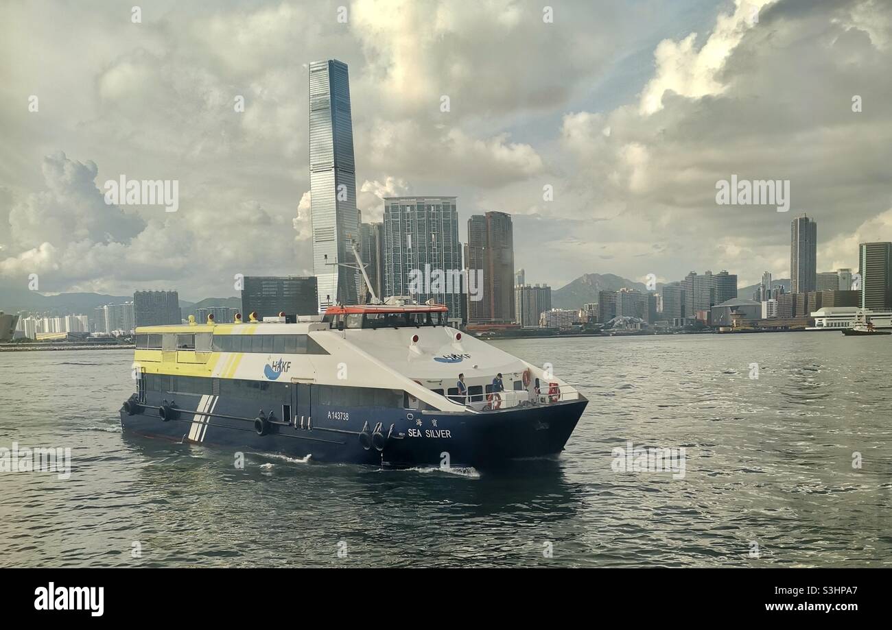 A ferry approaches the central pier on HK island in Hong Kong. - Smartphone Captured Stock Image