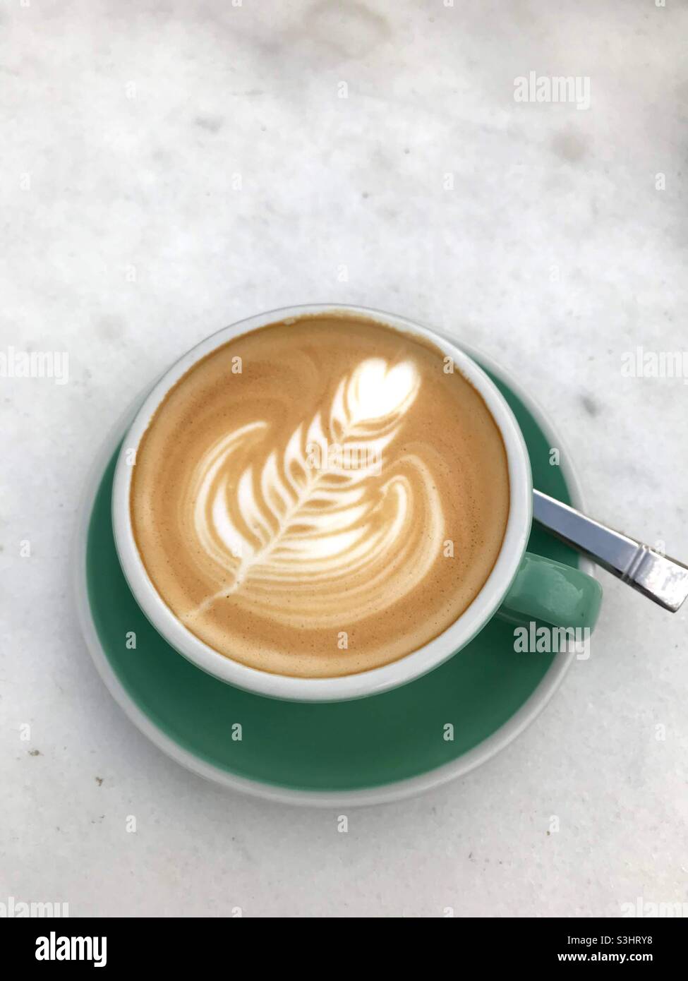 Coffee cappuccino in green cup Stock Photo