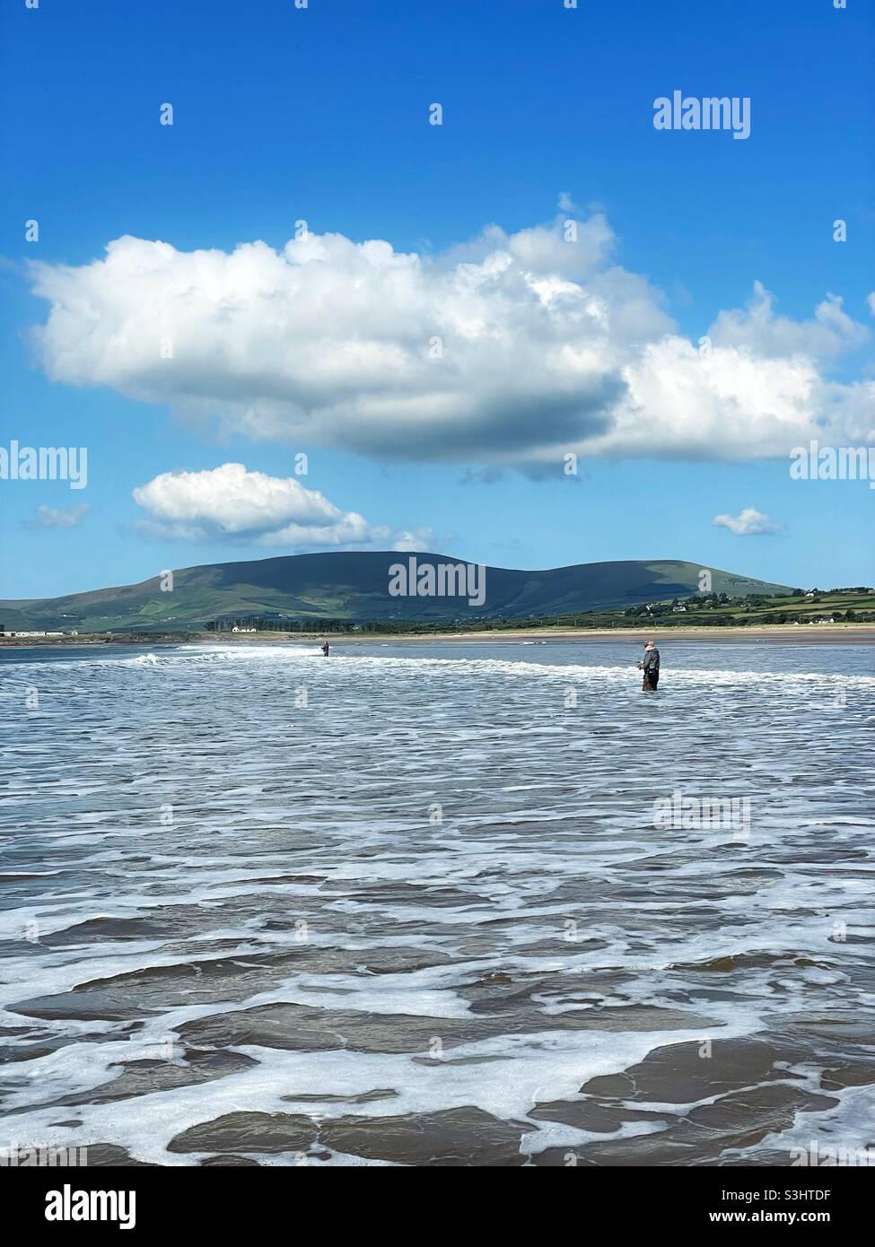 Anglers fishing the surf for bass in County Kerry, Ireland. - Smartphone Captured Stock Image