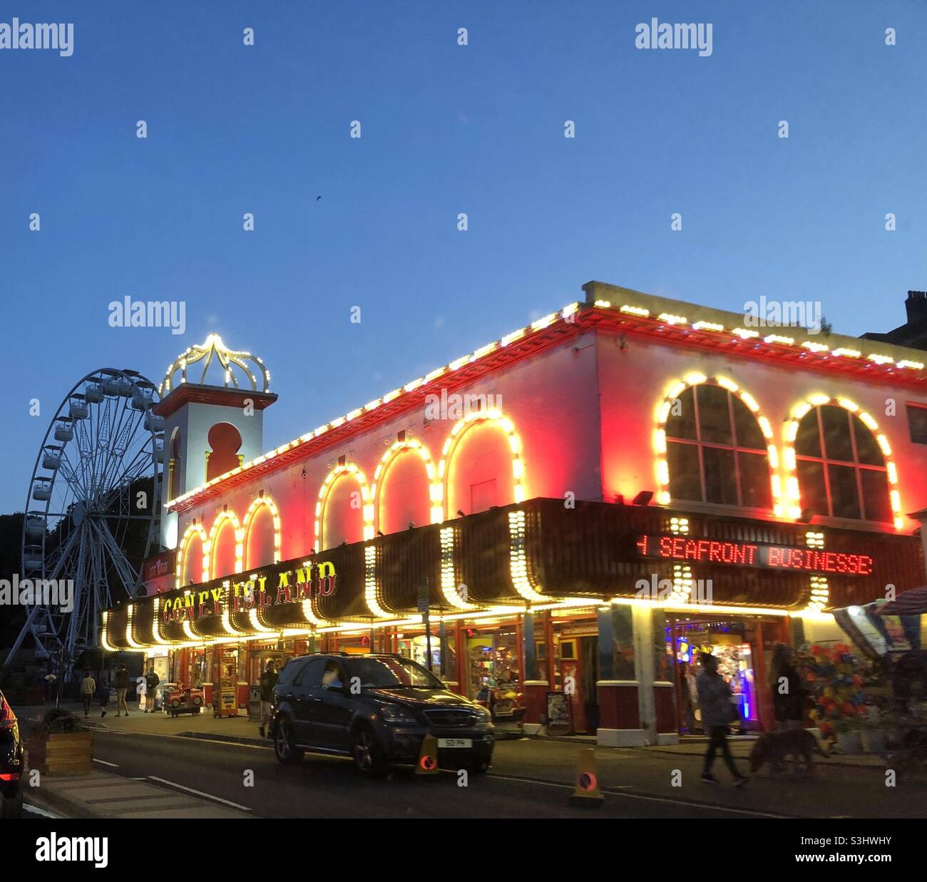Seafront amusement arcade at dusk - Smartphone Captured Stock Image