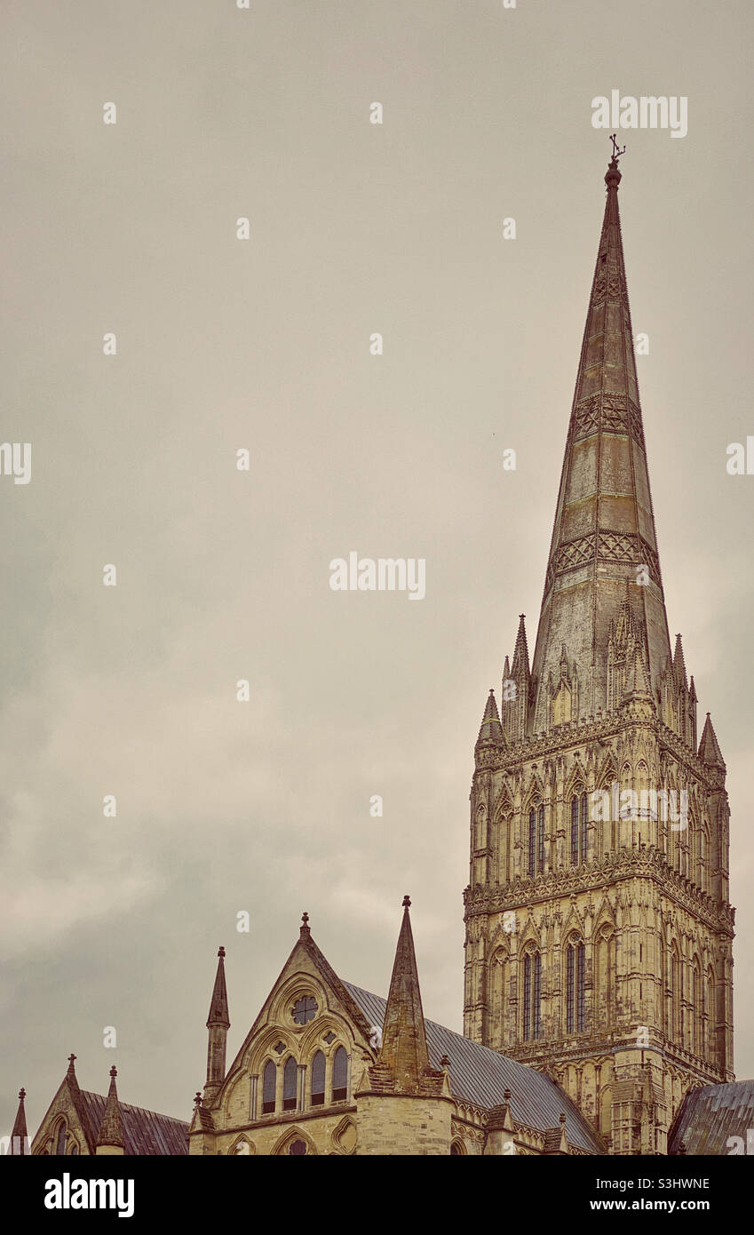 An atmospheric image of the Salisbury Cathedral Spire. The Cathedral was built between 1220 and 1258. The Cathedral Spire is the tallest in the UK and was built around 1320. Photo ©️ COLIN HOSKINS. - Smartphone Captured Stock Image