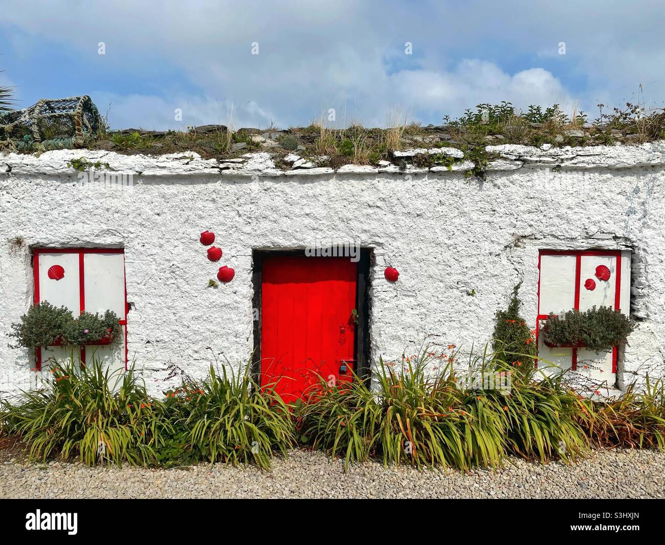 Decorated derelict house in Port Magee, County Kerry, Ireland, August. - Smartphone Captured Stock Image