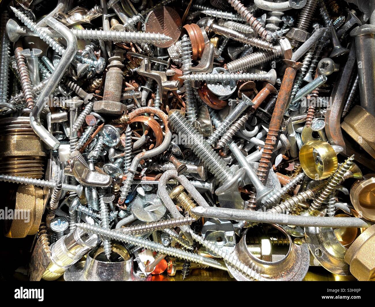 Close up view of metal screws, nuts and bolts - Smartphone Captured Stock Image