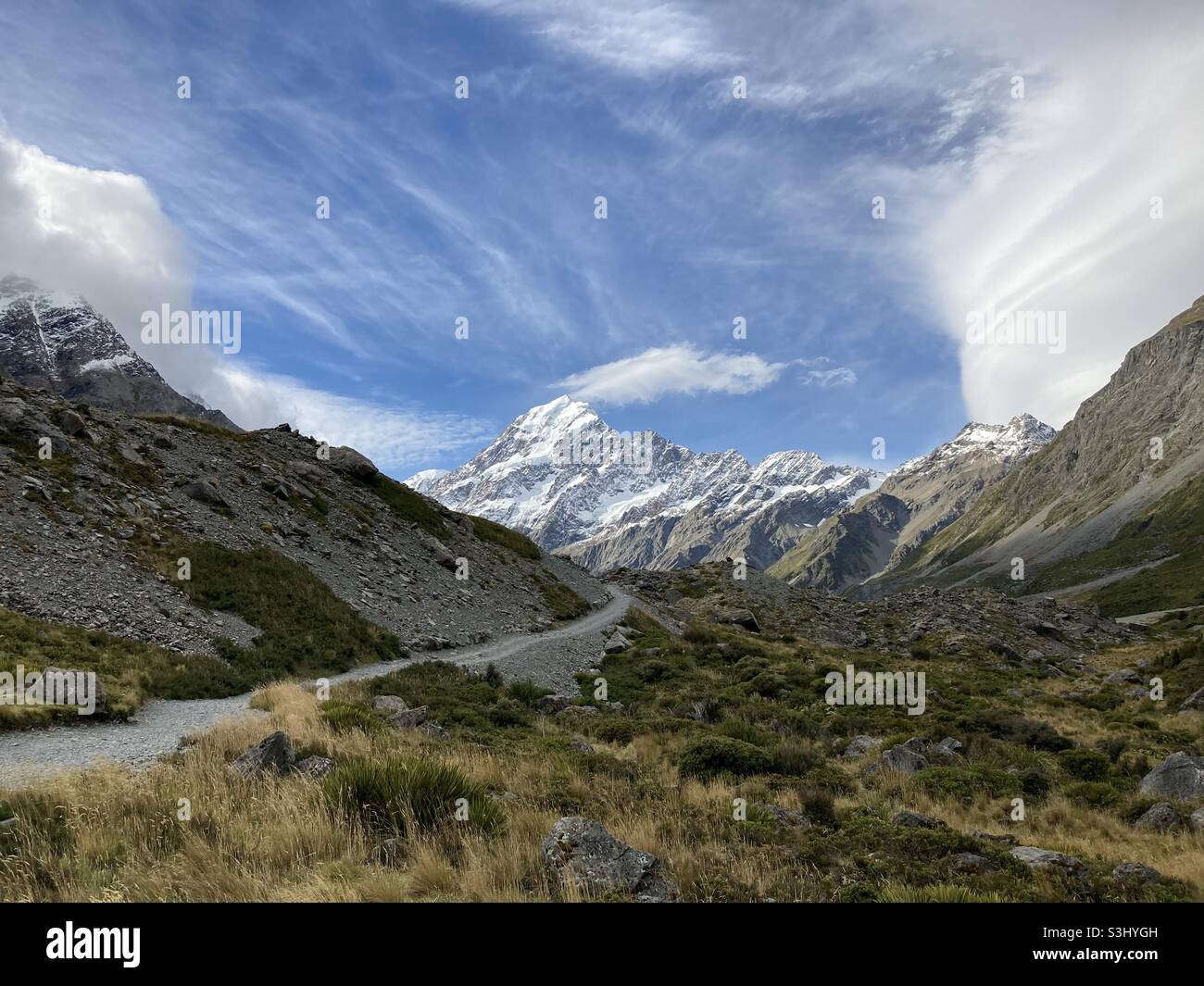 Mt Cook, New Zealand in the Rocky Landscape of Hooker Valley with a Cloudy Blue Sky Stock Photo