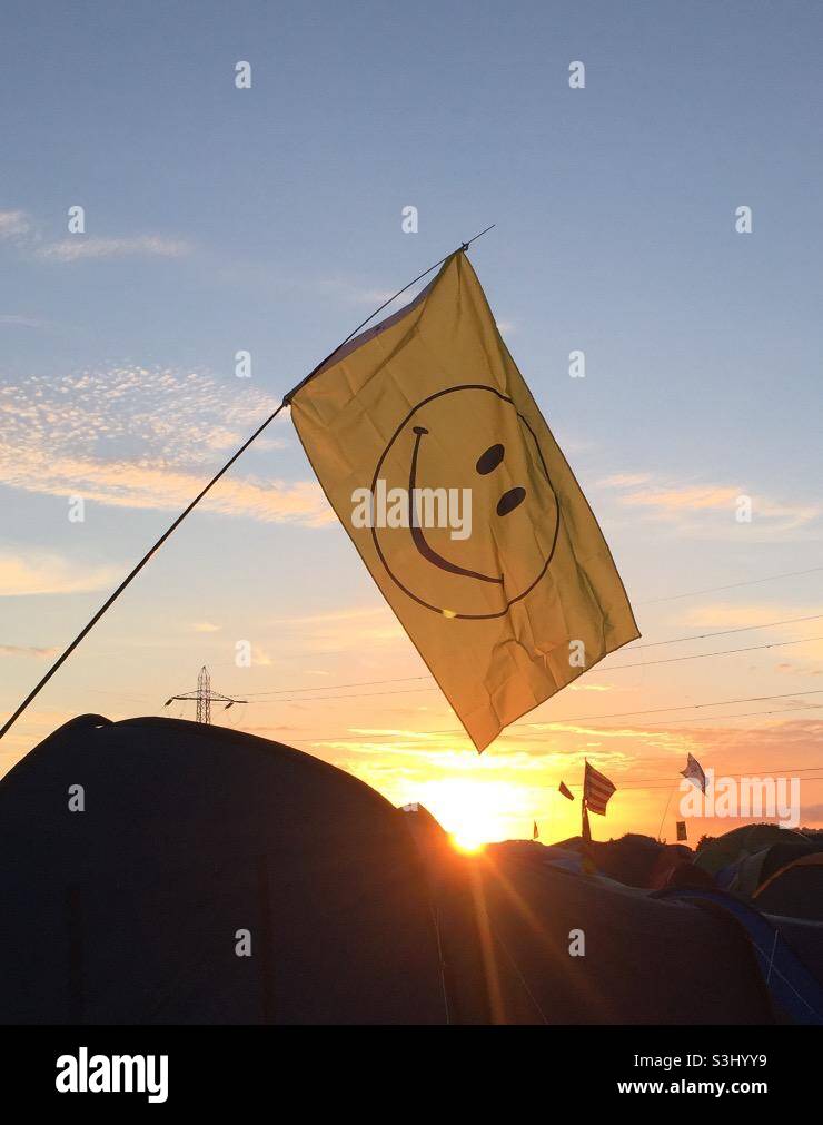 Smiley flag at Glastonbury Stock Photo