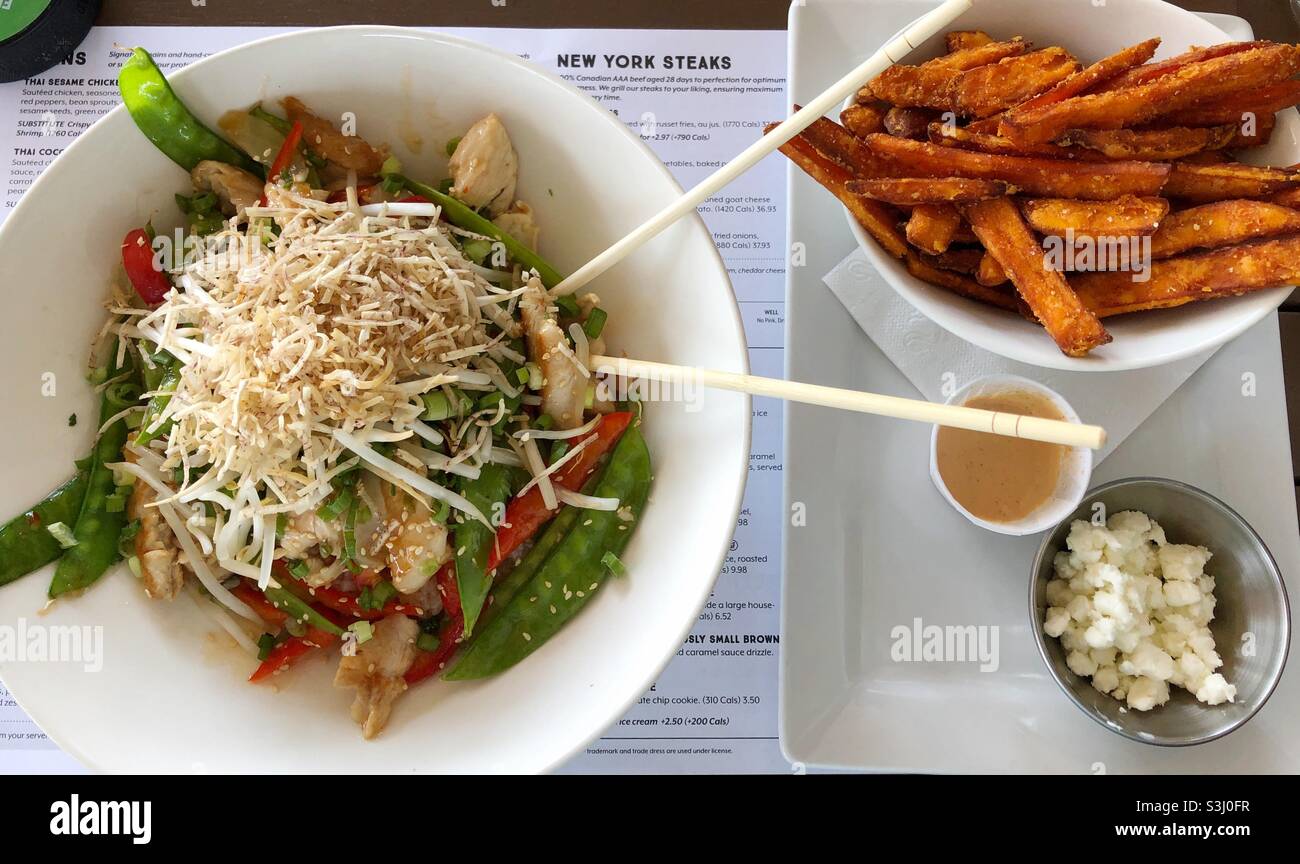 Thai stir fry with sweet potato fries Stock Photo Alamy