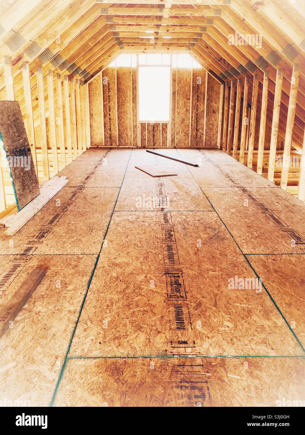 View down unfinished house attic - Smartphone Captured Stock Image