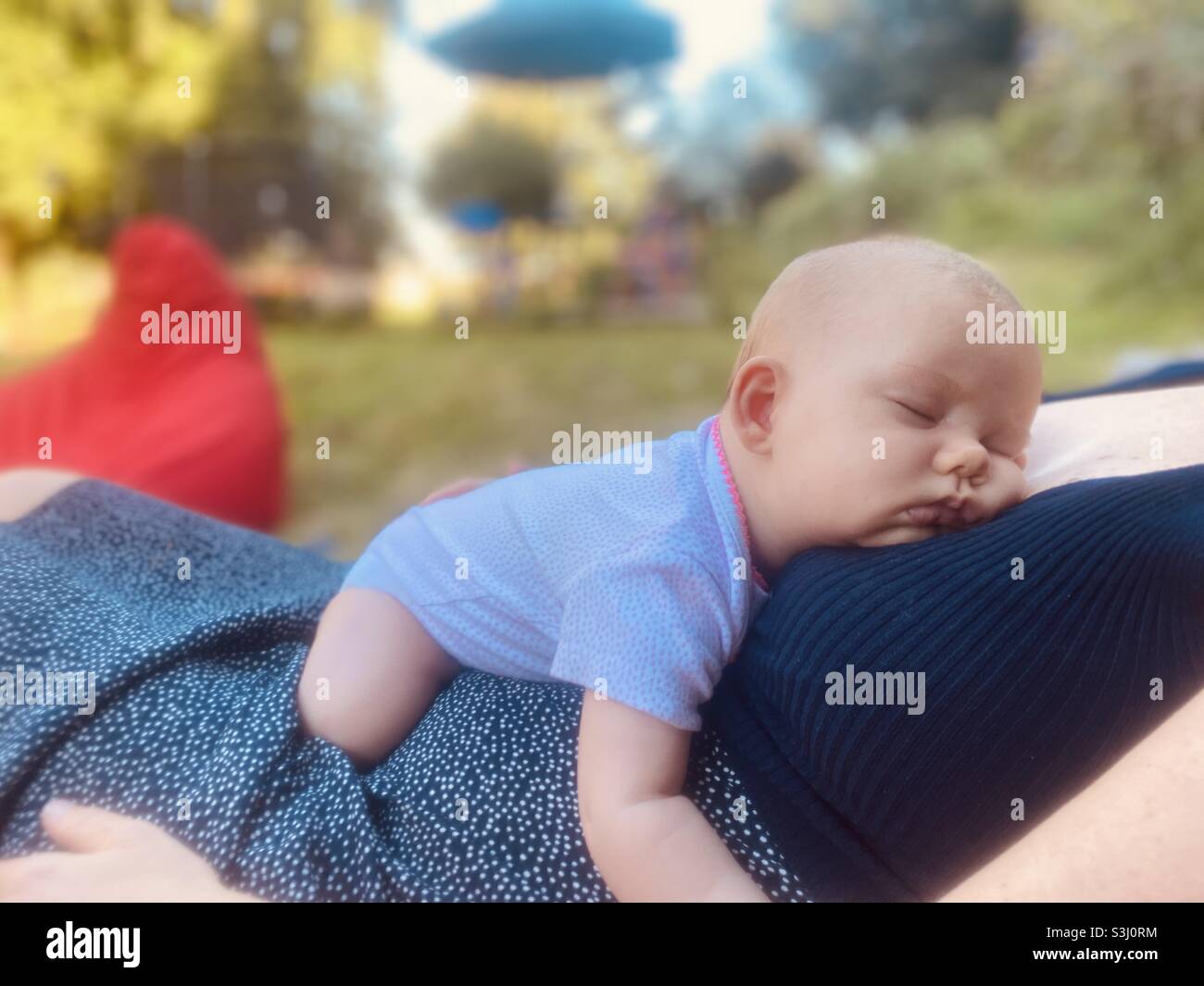 Baby sleeping outside Stock Photo Alamy