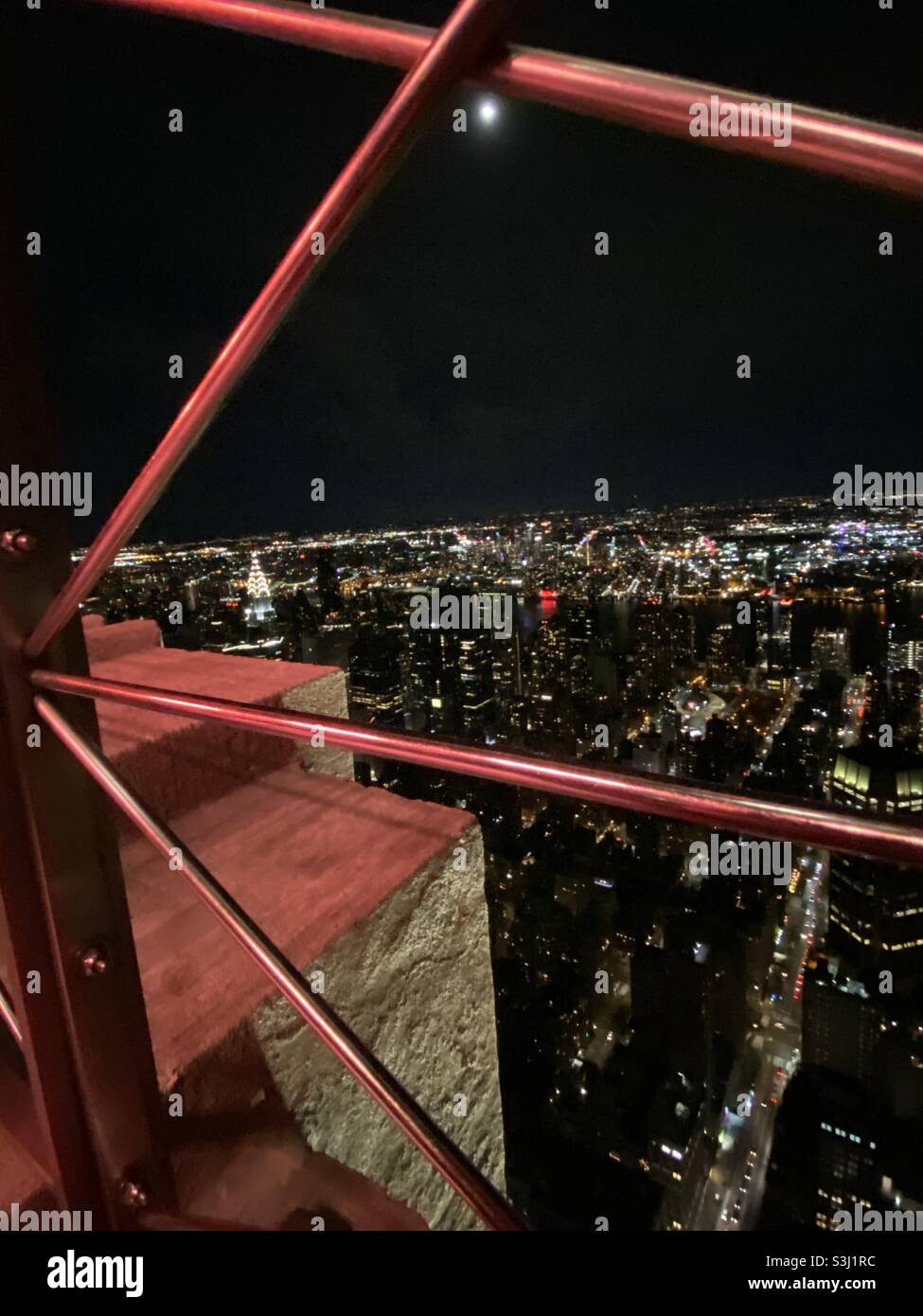 New York by night showing the Chrysler building. Taken from the Empire State Building in December 2019 - Smartphone Captured Stock Image