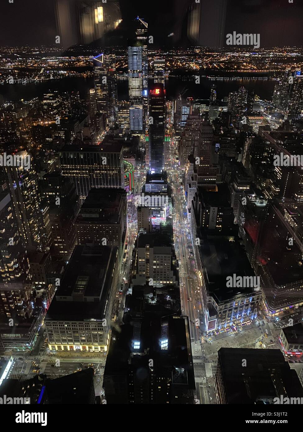 New York by night taken from the Empire State Building showing Macy’s & Madison Square Garden with the Hudson River in the distance. Taken December 2019 - Smartphone Captured Stock Image