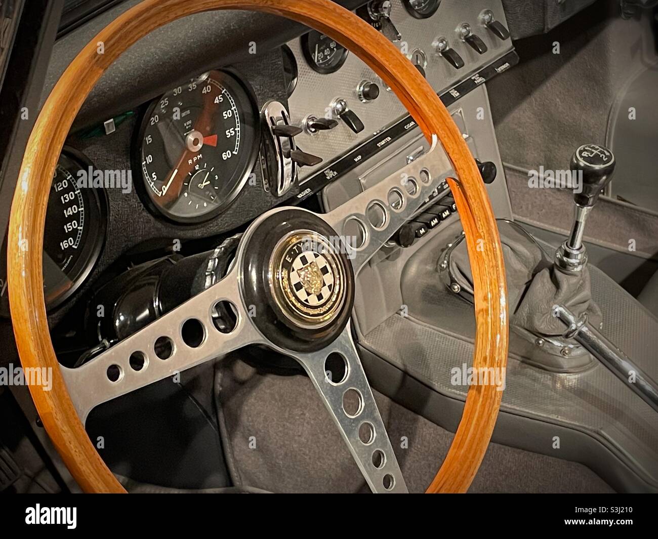 Close up of a steering wheel of a vintage jaguar XKE on display at MOMA