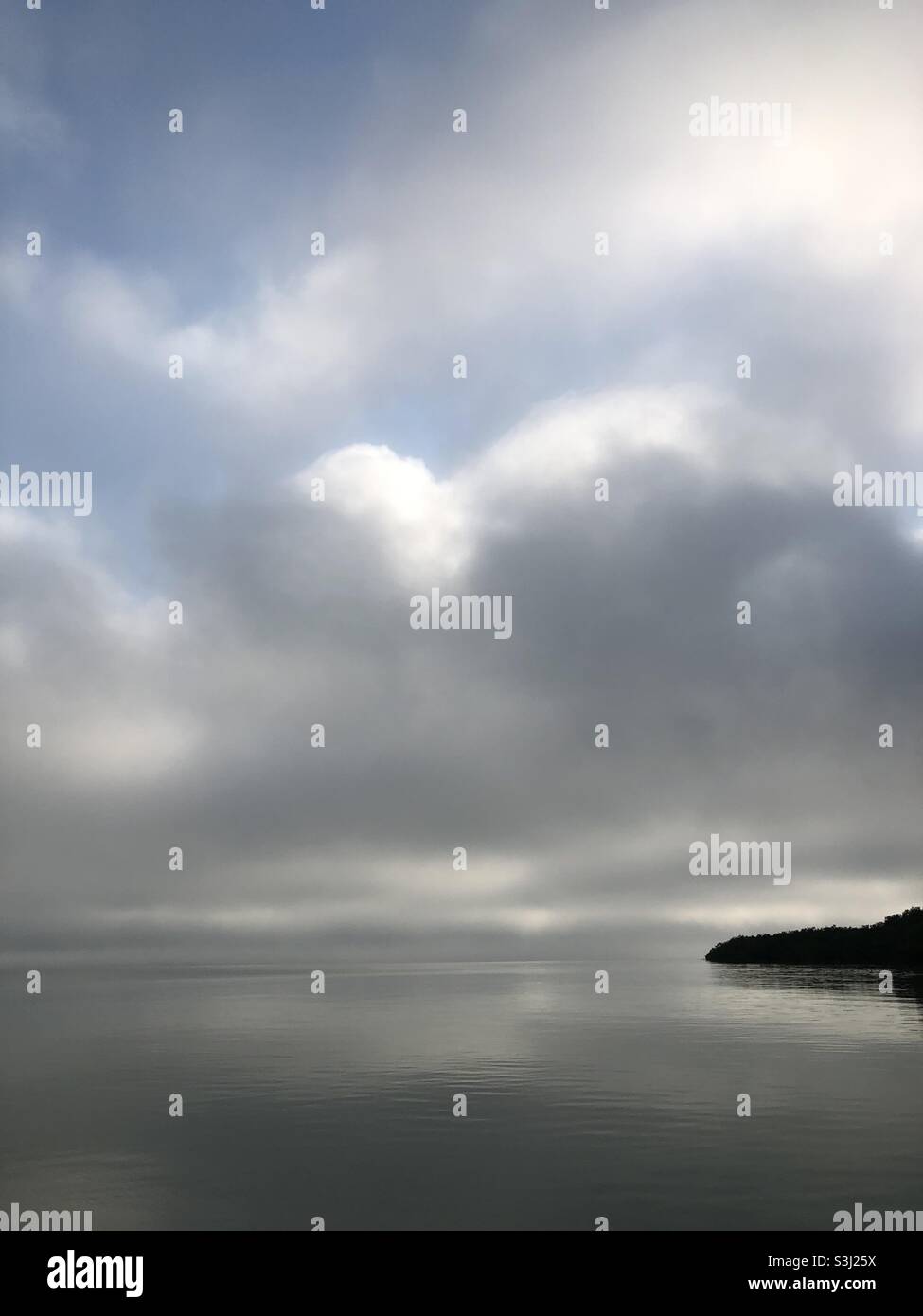 Water and land in the myst - Smartphone Captured Stock Image