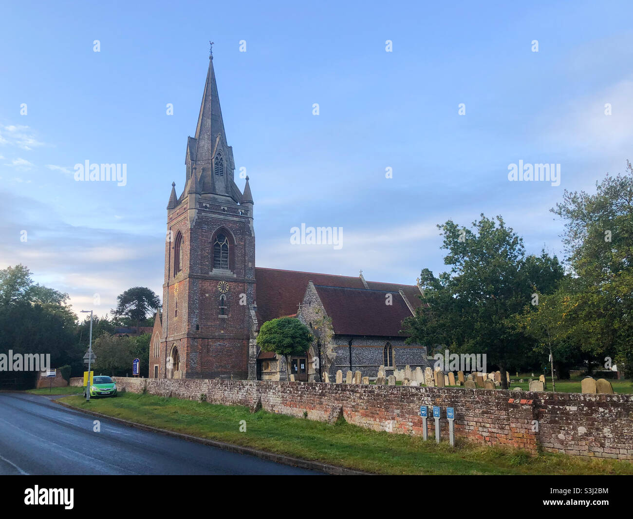 St Michael’s Church in Tilehurst, Reading seen against a blue sky Stock