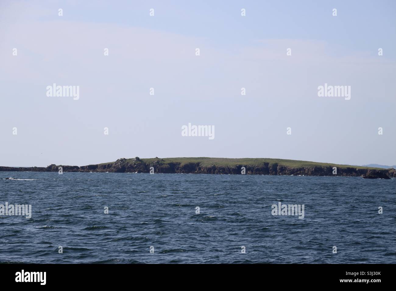 View on the coastline of the island Houat in Brittany in the French department of Morbihan - Smartphone Captured Stock Image