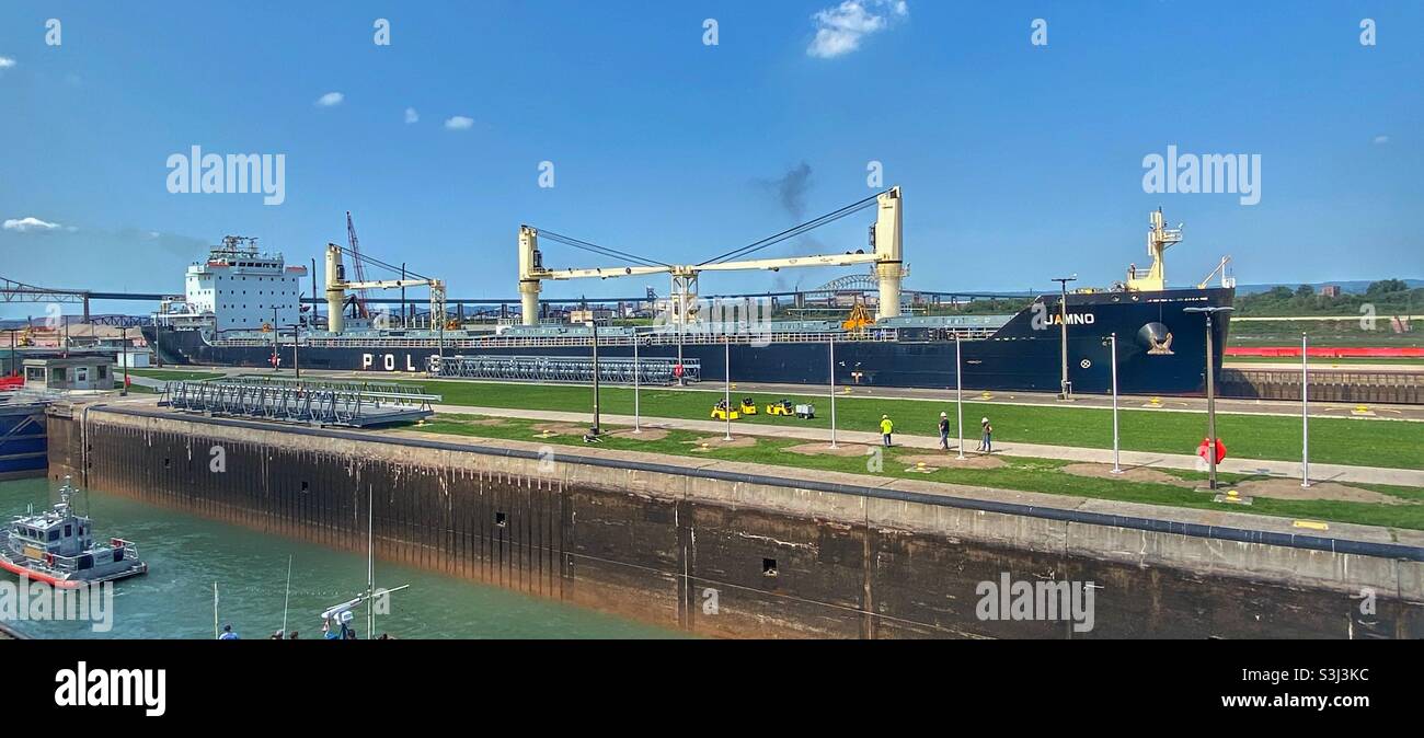 Large cargo ship in the Soo Locks, Sault Sainte-Marie, after water is lowered. - Smartphone Captured Stock Image