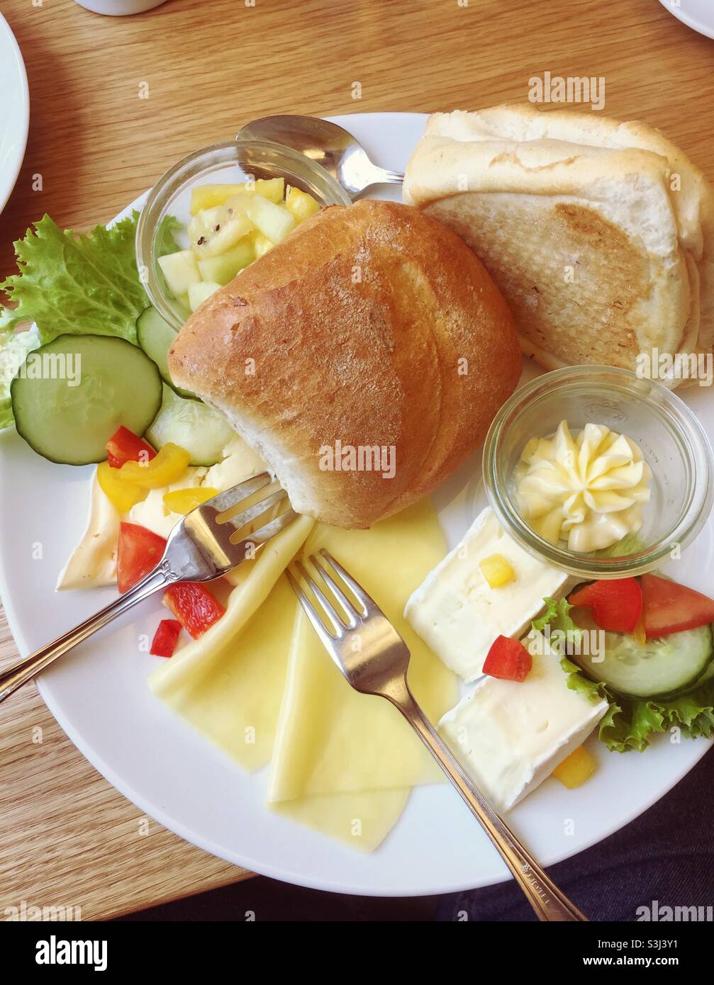 Decorated breakfast plate with cheese fruits and vegetables - Smartphone Captured Stock Image