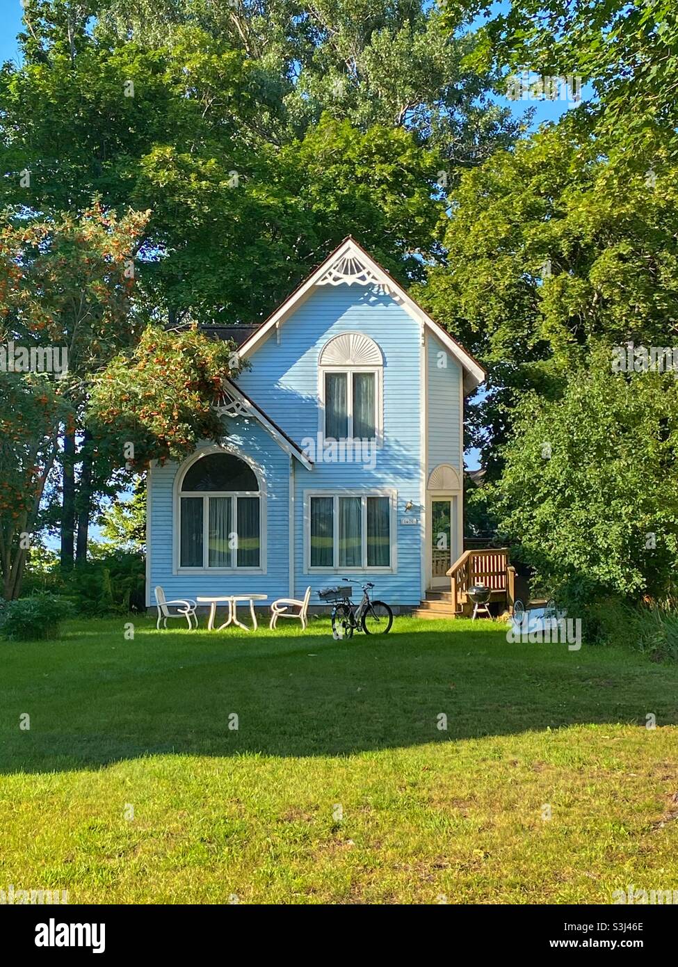 Cute house that looks like it should be a doll house Stock Photo