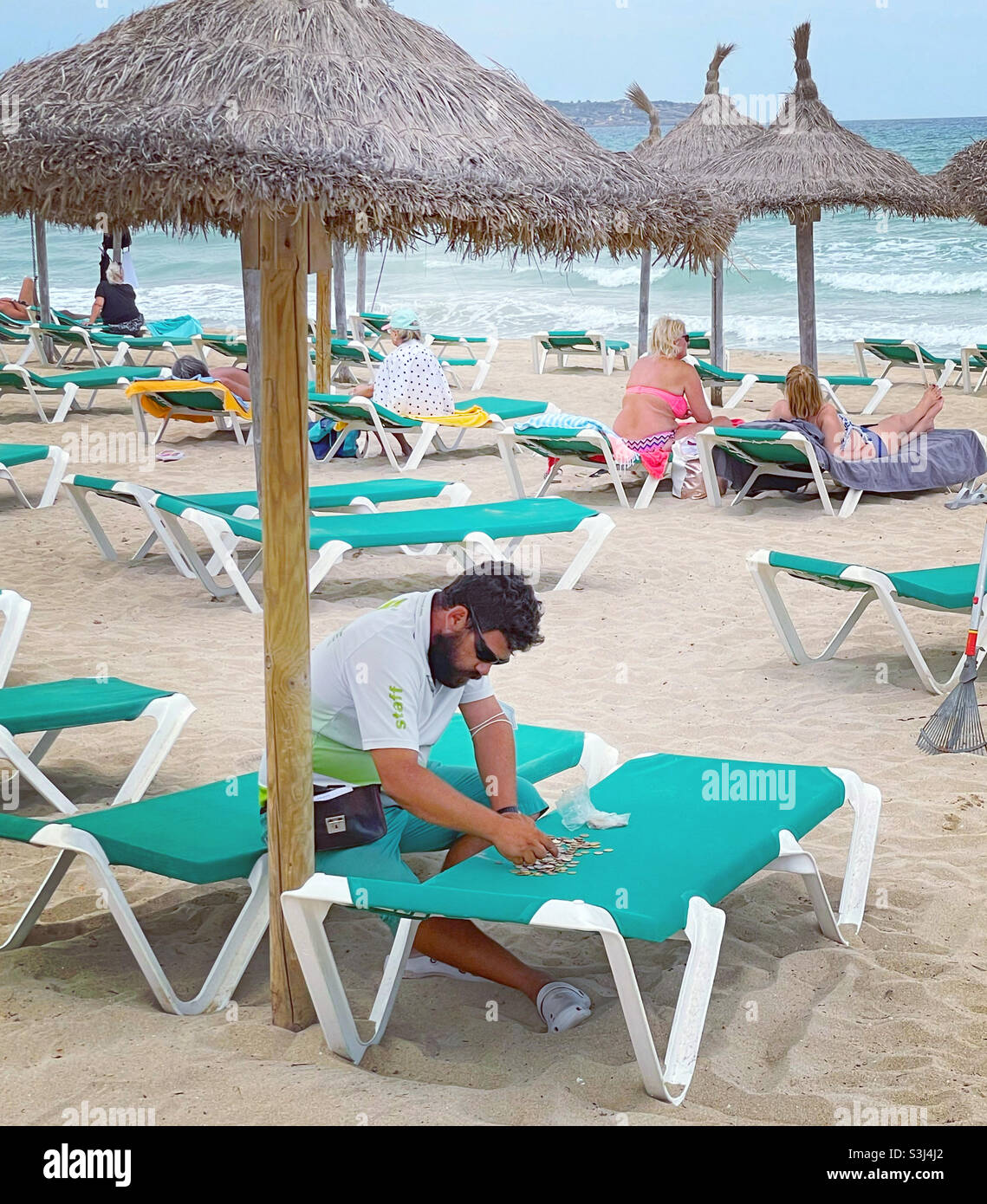Beach Chair Seller. - Smartphone Captured Stock Image