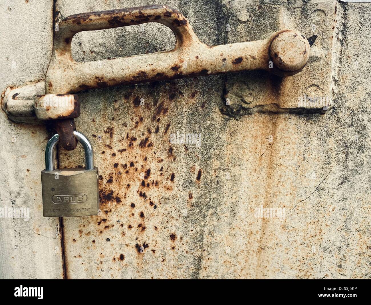Rusty lever with padlock - Smartphone Captured Stock Image