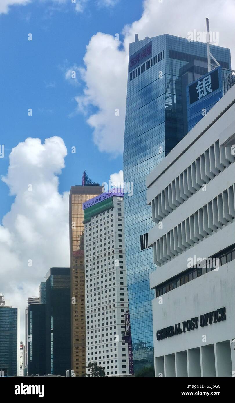 The General Post Office building along modern buildings in Hong Kong. - Smartphone Captured Stock Image