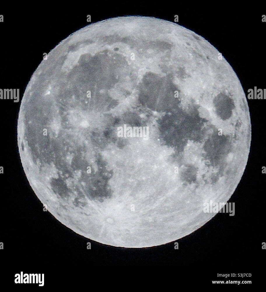 The full moon on September 20, 2021 as seen from Glasgow, Scotland. September’s full moon is known as the Harvest Moon or the Corn Moon - Smartphone Captured Stock Image
