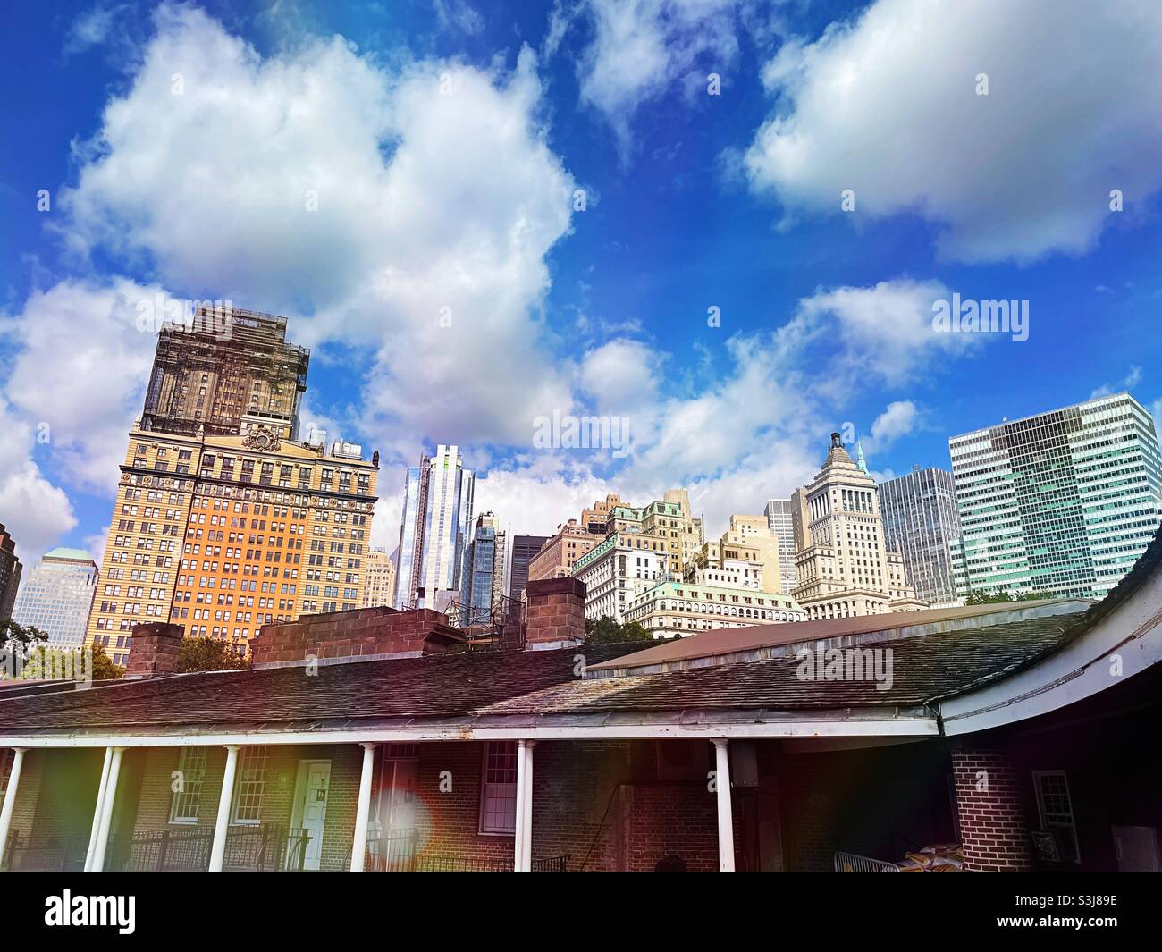 Office buildings in the financial district as seen from the inside Plaza of Castle Clinton in battery Park, 2021, New York City, United States - Smartphone Captured Stock Image
